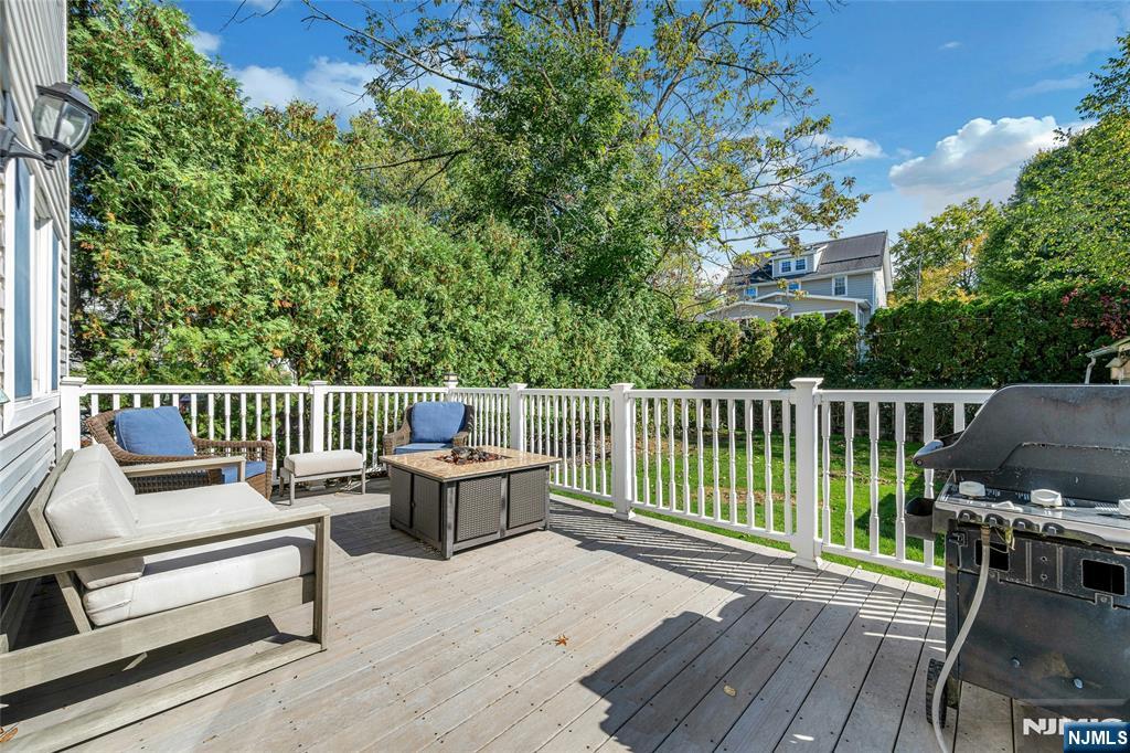 66 Smull Avenue Caldwell, NJ 07006 - Photo 30 of 32 a view of a chair and table on the wooden deck