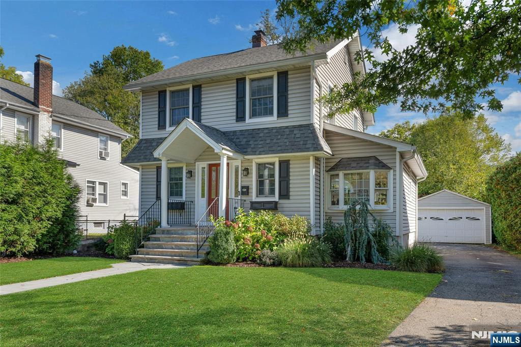 66 Smull Avenue Caldwell, NJ 07006 - Photo 3 of 32 a front view of a house with a garden