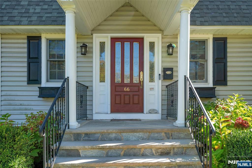 66 Smull Avenue Caldwell, NJ 07006 - Photo 4 of 32 front view of a house with a yard