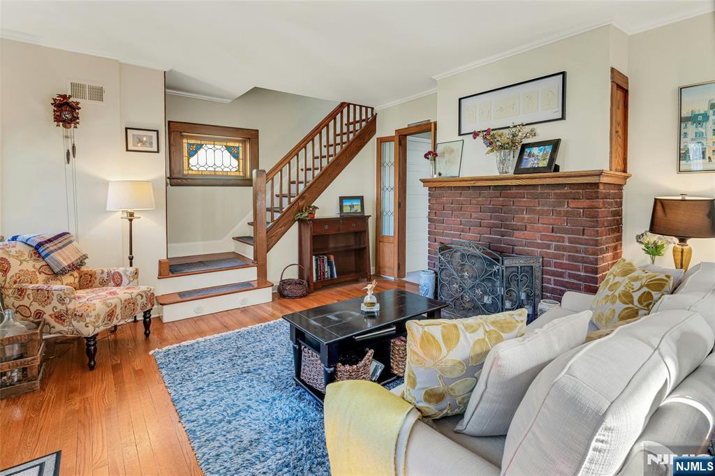 66 Smull Avenue Caldwell, NJ 07006 - Photo 7 of 32 a living room with furniture floor to ceiling window and wooden floor