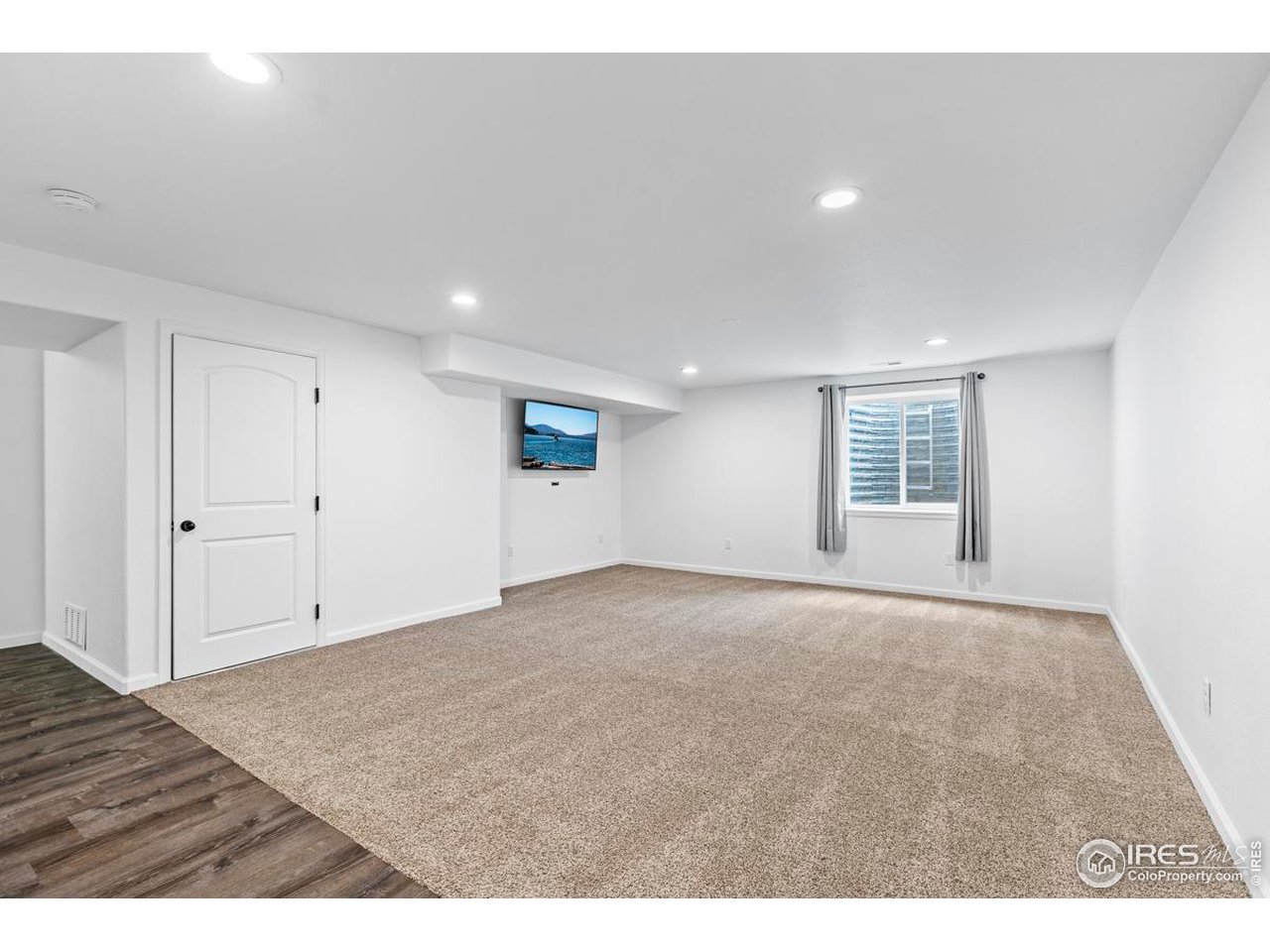1010 Axis Drive Severance, CO 80550 - Photo 23 of 33 a view of an empty room with wooden floor