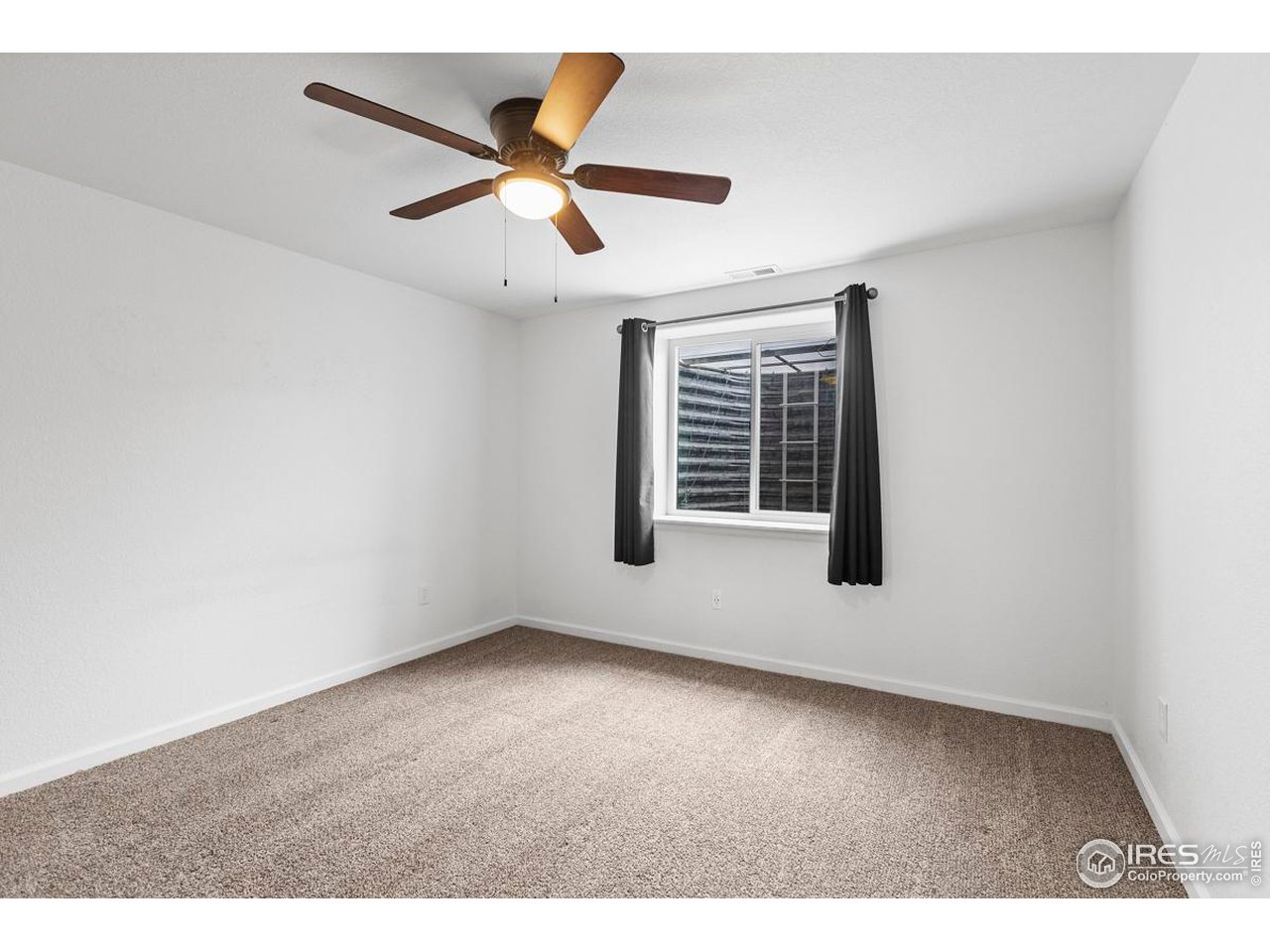 1010 Axis Drive Severance, CO 80550 - Photo 30 of 33 a view of an empty room with a window