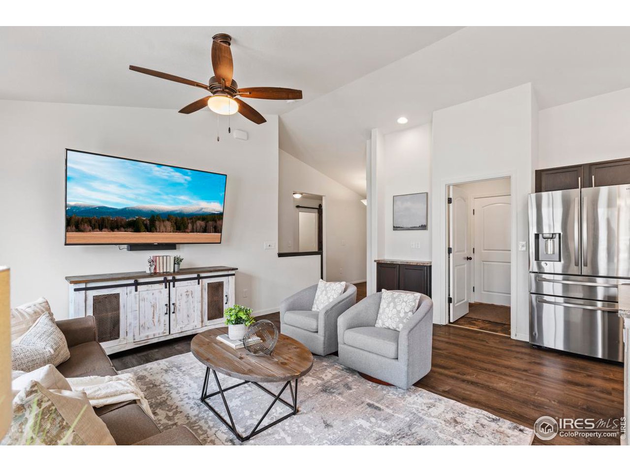 1010 Axis Drive Severance, CO 80550 - Photo 7 of 33 a living room with furniture and a flat screen tv