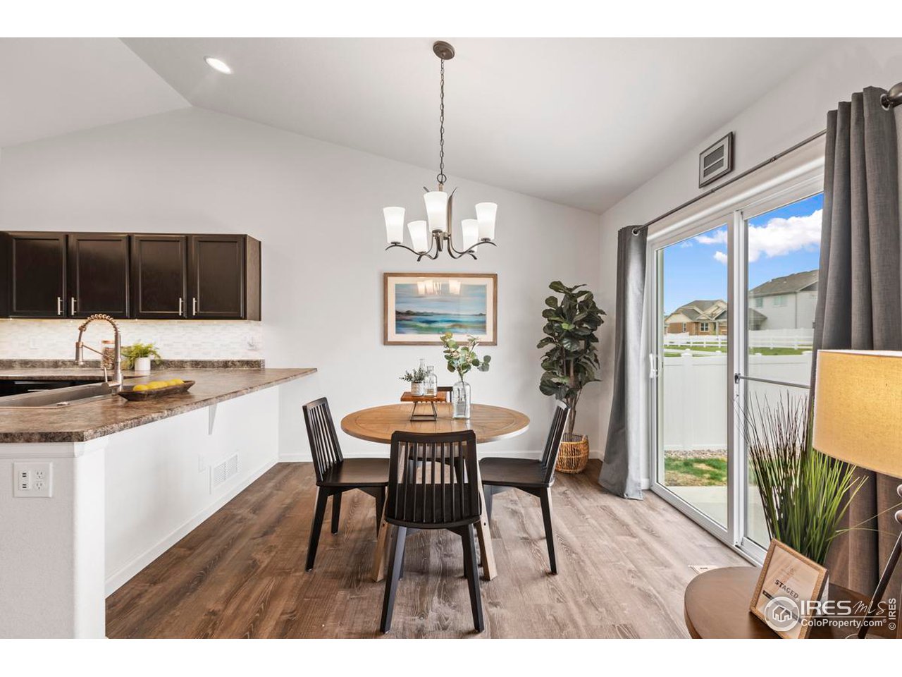 1010 Axis Drive Severance, CO 80550 - Photo 8 of 33 a view of a dining room with furniture window and outside view
