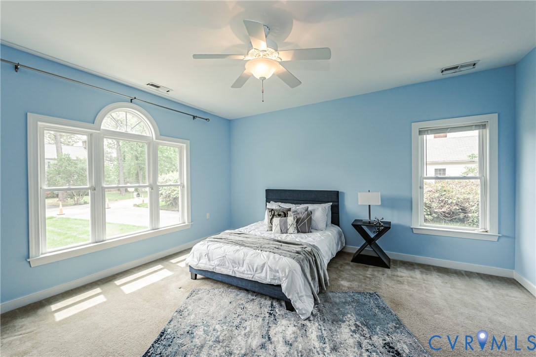 2018 Valentine Road Henrico, VA 23228 - Photo 40 of 65 a bedroom with a large bed and a large window