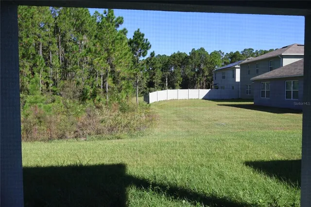 a view of a garden with an outdoor space