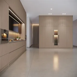 a view of an empty room and wooden floor