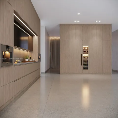 a view of an empty room and wooden floor