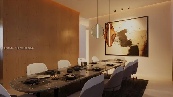 a table with chairs and painting on it