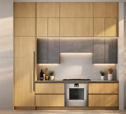 a kitchen with stainless steel appliances granite countertop a sink and a stove