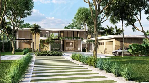 a front view of a house with a yard and potted plants