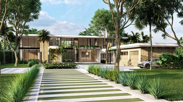 a front view of a house with a yard and potted plants