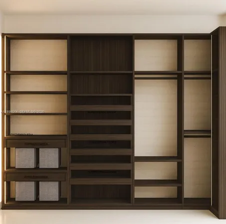 a view of an empty room with empty cabinets