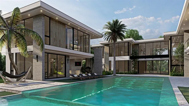 a view of a house with backyard porch and sitting area