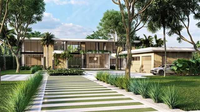 a front view of a house with a yard and potted plants