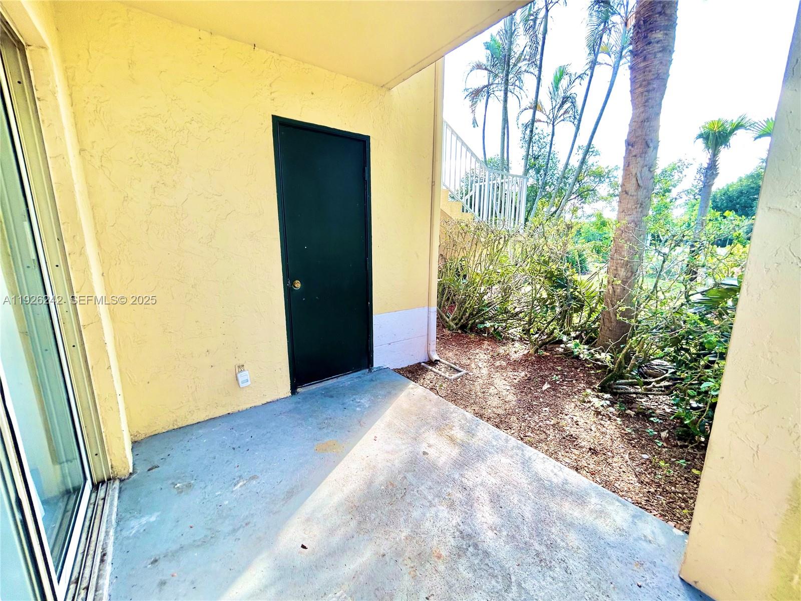 6340 La Costa Drive, Unit A Boca Raton, FL 33433 - Photo 18 of 28 a view of a back yard from a corridor