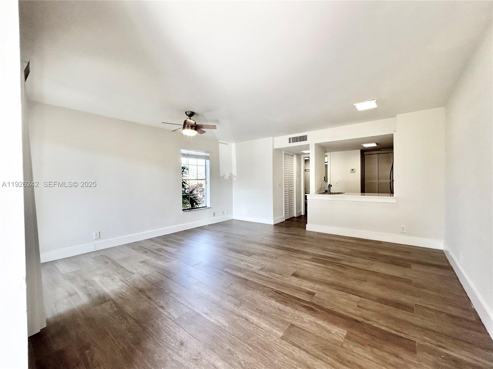 6340 La Costa Drive, Unit A Boca Raton, FL 33433 - Photo 2 of 28 wooden floor in an empty room