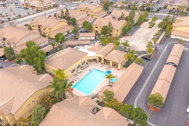 an aerial view of a house with a yard and lake view