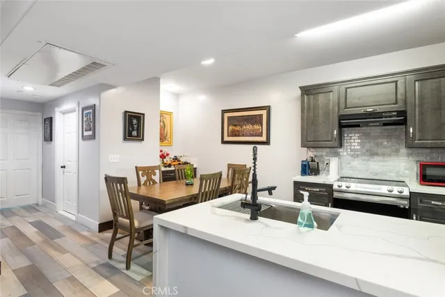 a view of a kitchen with a sink and a microwave