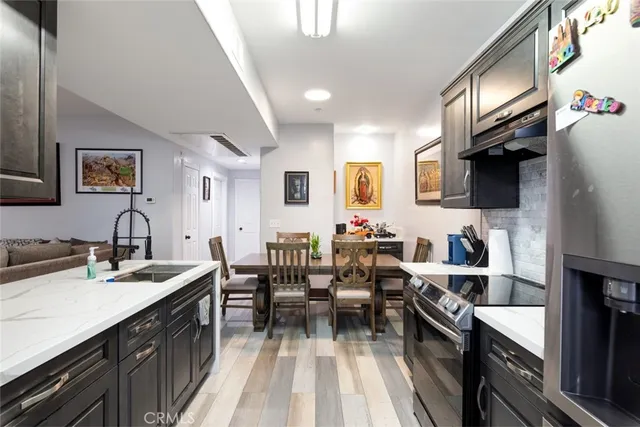 a kitchen with sink cabinets and stove