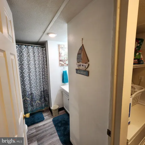 a bathroom with a sink and a shower curtain