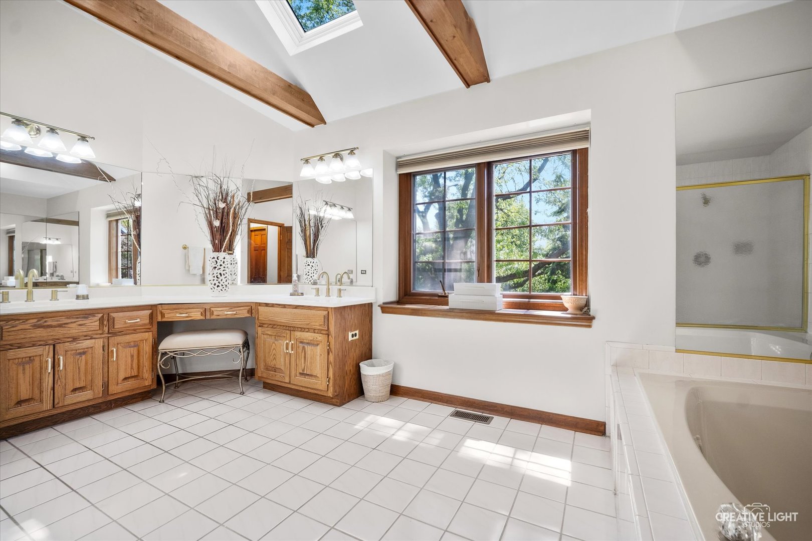 3112 Turnberry Road St. Charles, IL 60174 - Photo 23 of 43 a large white bathroom with a large tub sink and mirror