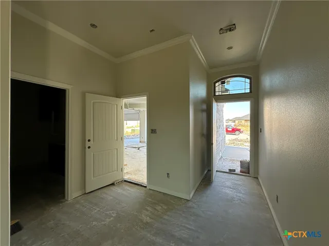 an empty room that has a mirror