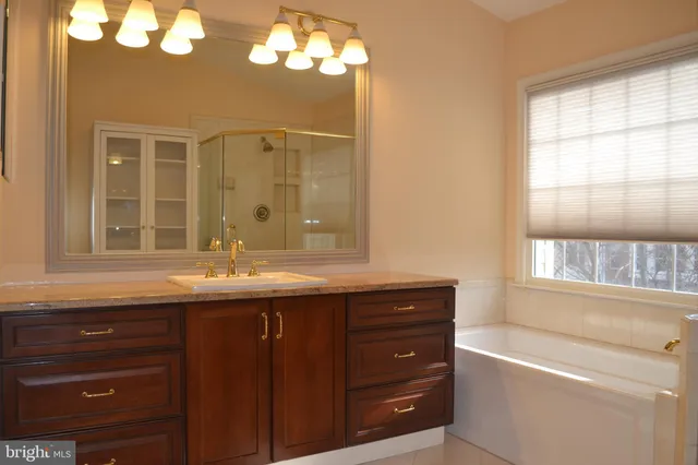a bathroom with a shower and a sink