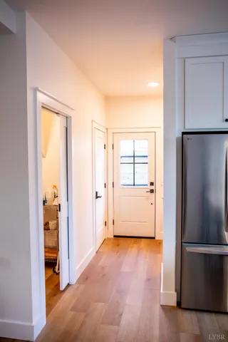 a kitchen with stainless steel appliances a stove a sink a center island and cabinets