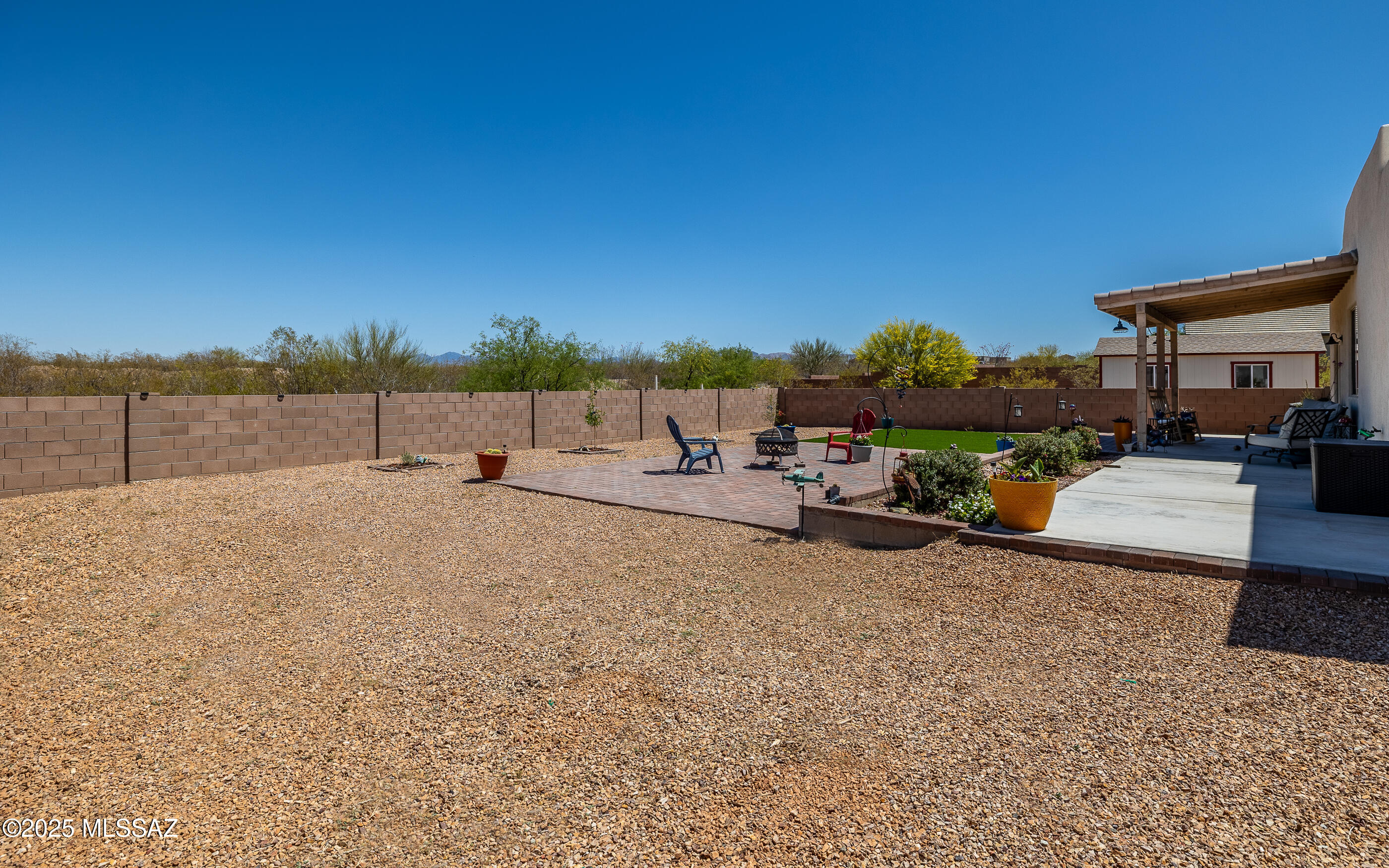 12123 Creosote Valley Road Vail, AZ 85641 - Photo 37 of 46 a view of a terrace with a bench