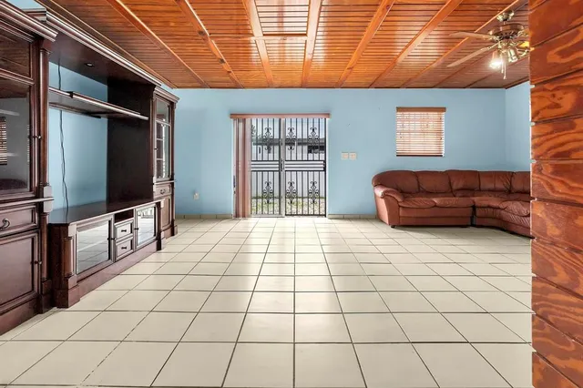 a living room with a couch and a flat screen tv