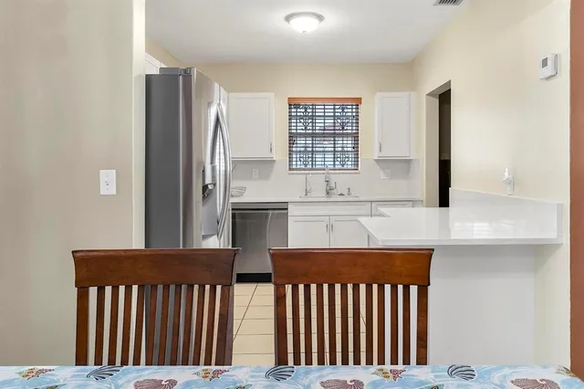 a kitchen with stainless steel appliances a window and a kitchen view