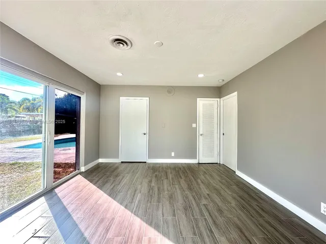 a view of closet area with empty racks