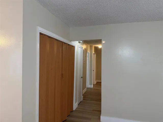 a view of gallery with wooden floor