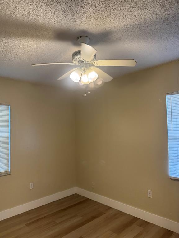 2156 Northwest 66th Street Miami, FL 33147 - Photo 19 of 29 a view of a small space with wooden floor and fan