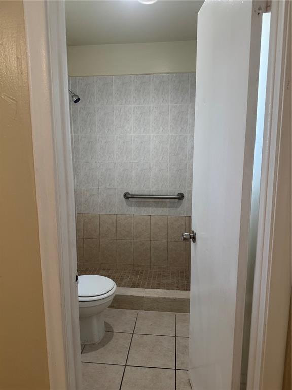 2156 Northwest 66th Street Miami, FL 33147 - Photo 23 of 29 a bathroom with a toilet and a shower
