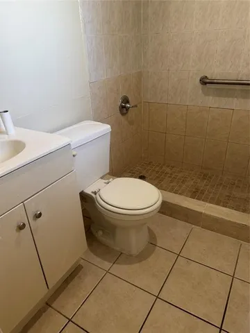 a bathroom with a toilet and a sink