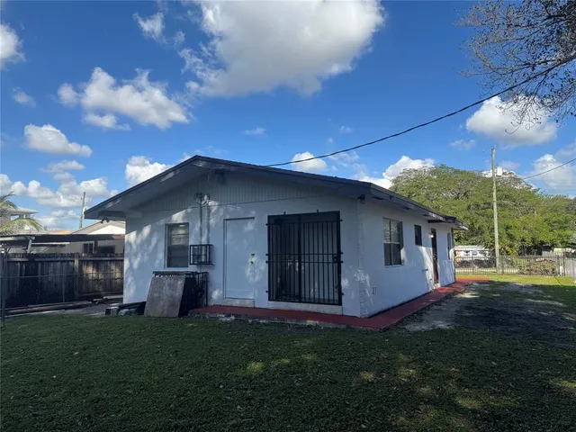 a backyard of a house with lots of green space