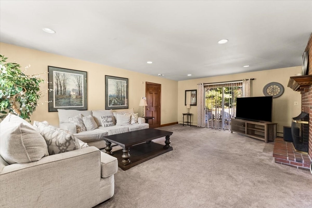 84 Juniper Ridge Road Westwood, MA 02090 - Photo 11 of 28 a living room with furniture and a flat screen tv