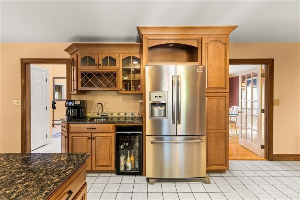 84 Juniper Ridge Road Westwood, MA 02090 - Photo 13 of 28 a kitchen with stainless steel appliances granite countertop a refrigerator and a stove