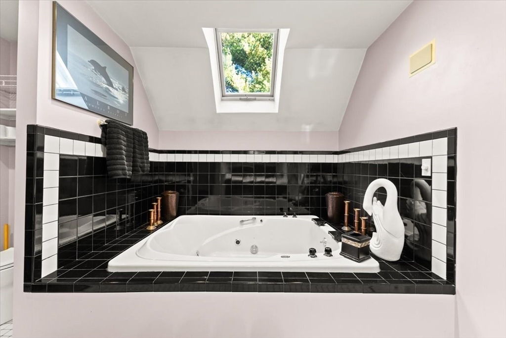 84 Juniper Ridge Road Westwood, MA 02090 - Photo 19 of 28 a white bath tub sitting in a bathroom