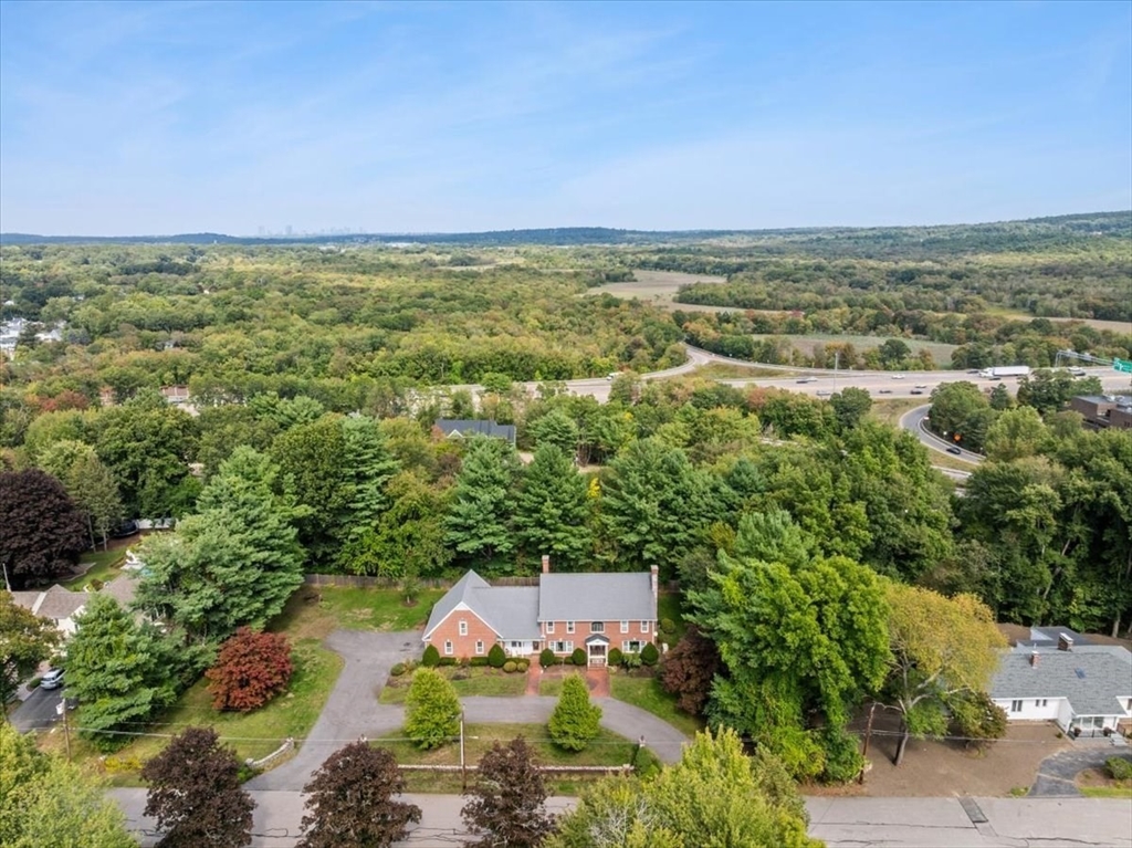 84 Juniper Ridge Road Westwood, MA 02090 - Photo 2 of 28 an aerial view of residential houses with outdoor space and trees
