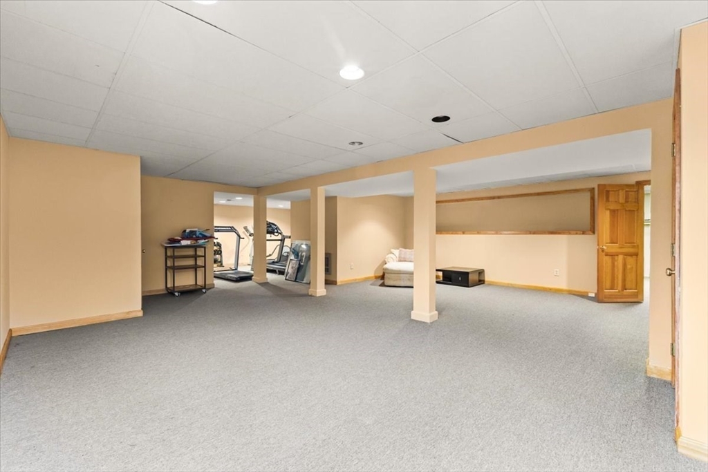 84 Juniper Ridge Road Westwood, MA 02090 - Photo 25 of 28 a view of a livingroom with furniture and a refrigerator