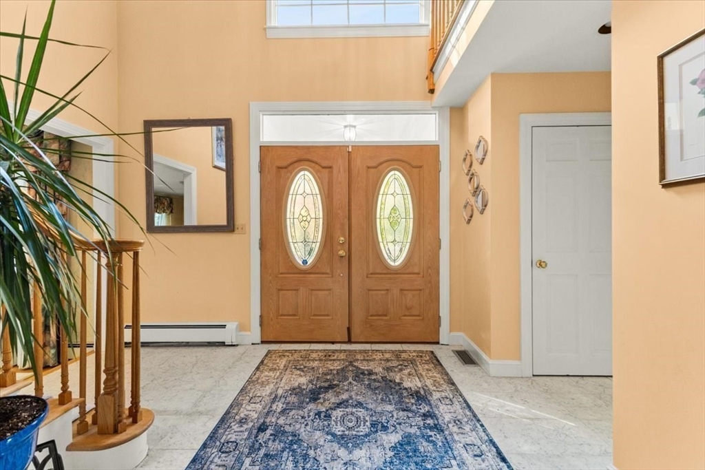 84 Juniper Ridge Road Westwood, MA 02090 - Photo 5 of 28 a view of a entryway door with wooden floor