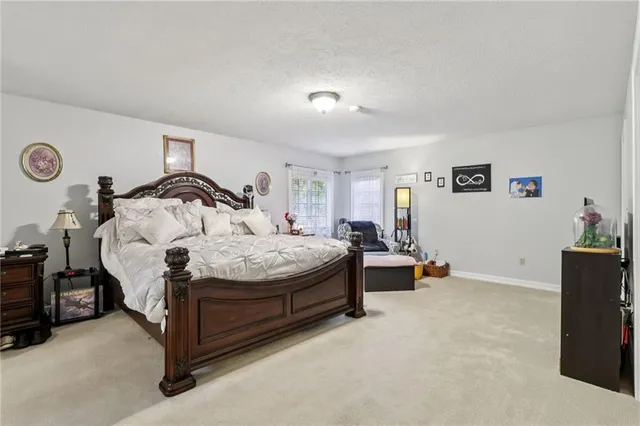 a bedroom with a bed and cabinets
