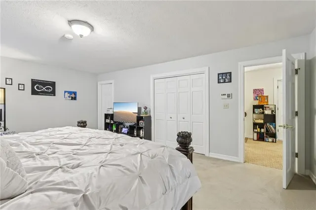 a bedroom with a bed and a cabinets