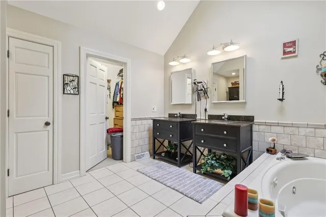 a bathroom with a toilet a sink and shower
