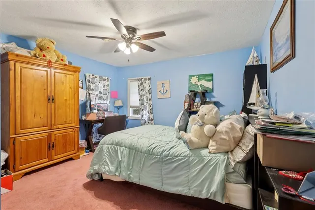 a bed room with a bed and a book shelf