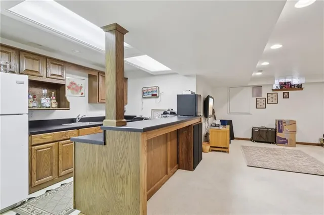 a living room with furniture and a mirror