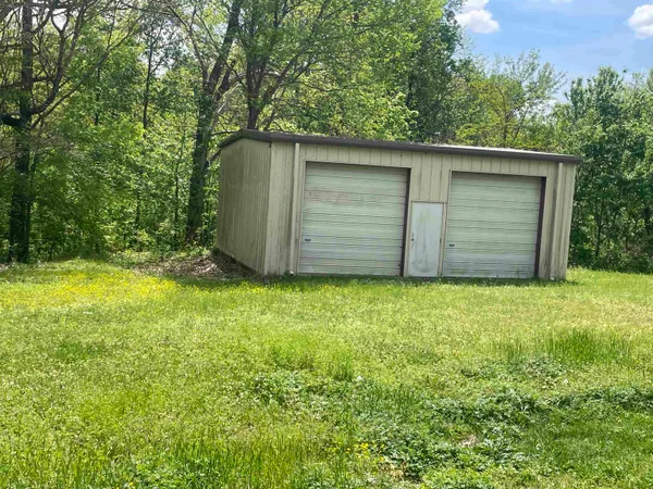 a view of a backyard of the house